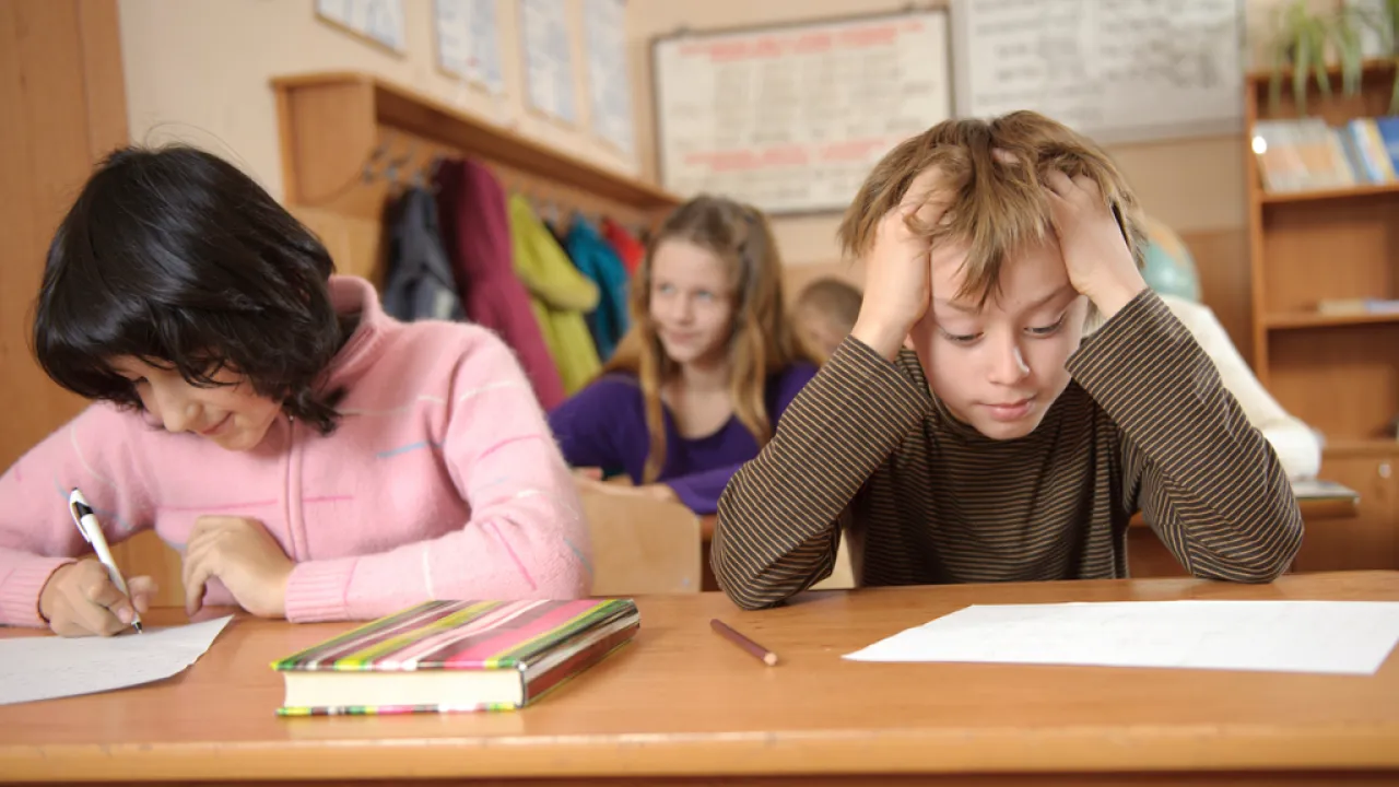 Treat.Diagnosis.Auditory processing disorder or ADHD in children.Article.731.boy classroom confused 3