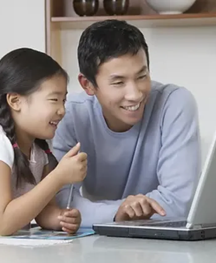 Father and daughter at computer